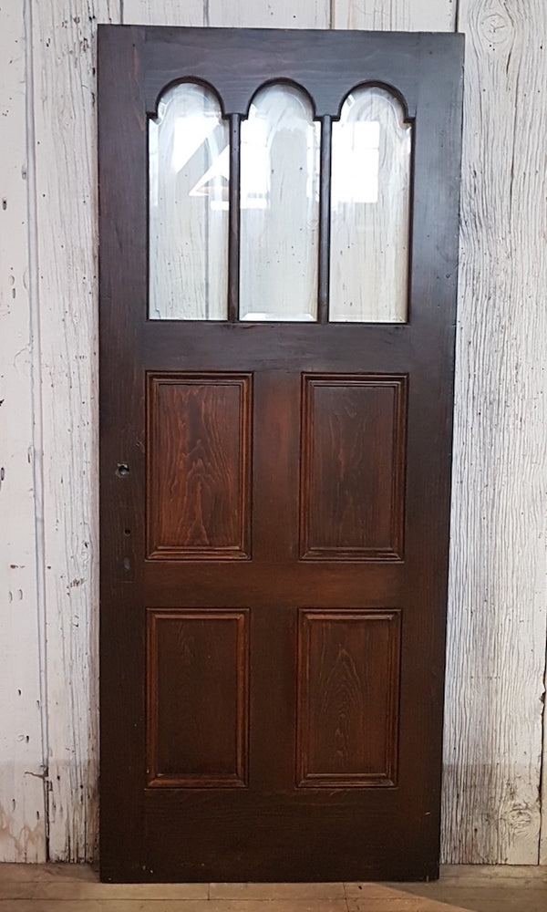Solid wood Entry Door with bevelled glass panels.