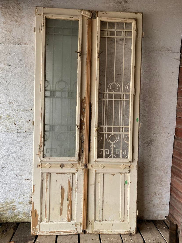 Antique European Glazed Double Doors  with iron grates.