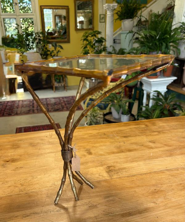 Brass faux bamboo shelf.