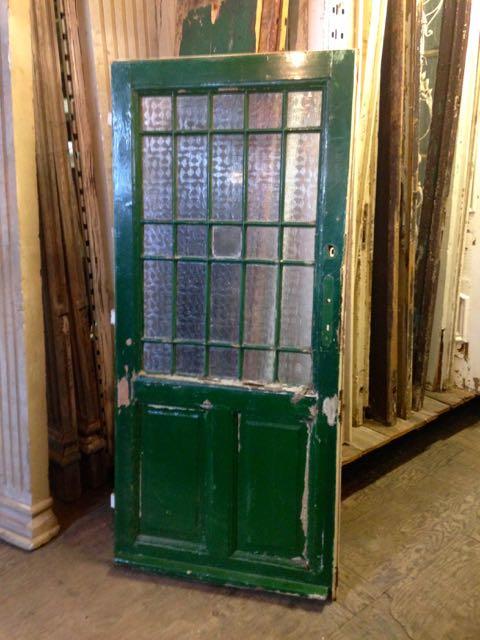 Antique European Door with decorative glass panels.