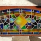 Antique Stained Glass Window with curved top in square frame