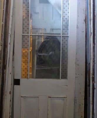 Beautiful antique oversize glazed exterior entry door with nine glass lites/panes