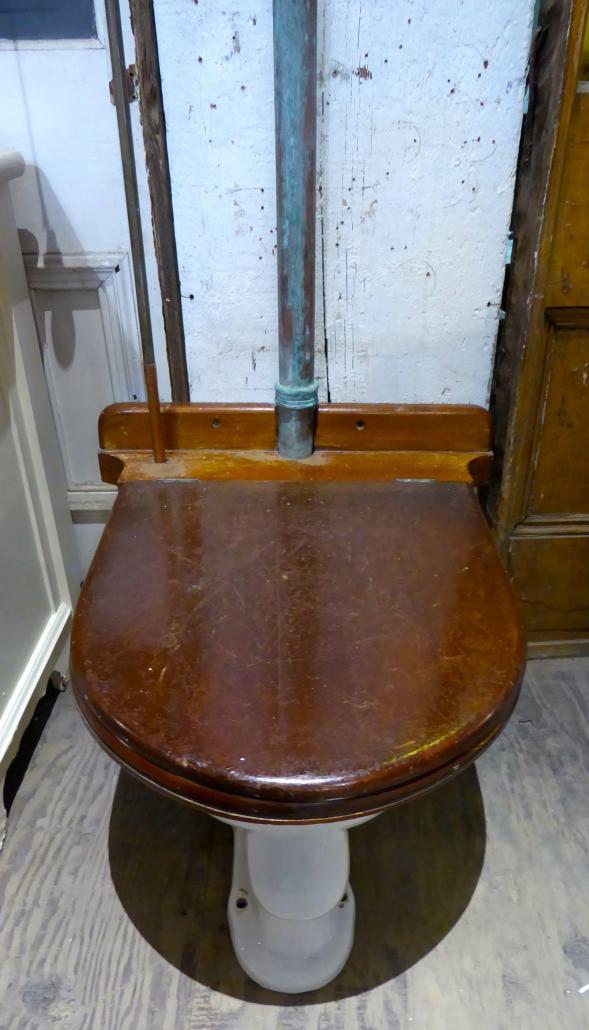 Antique toilet with wall mount tank