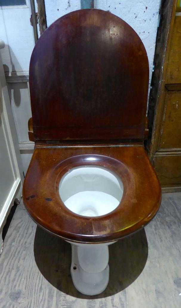 Antique toilet with wall mount tank