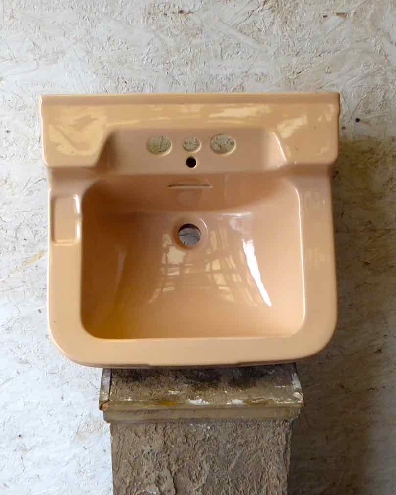 Peach coloured vintage bathroom sink