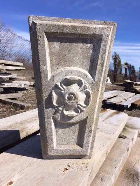 Antique keystone with decorative flower motif