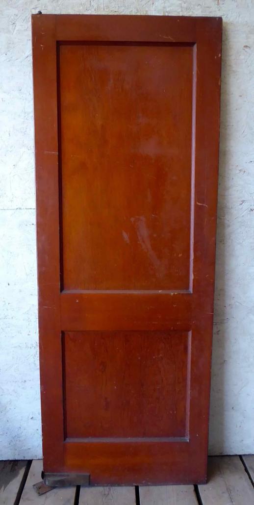 Antique single solid two panel interior wood door with swing pivot