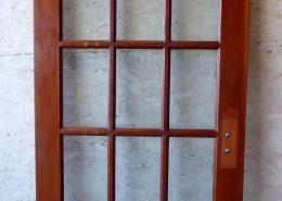 Antique single French door with fifteen glass panes / lites, with swing pivot. 