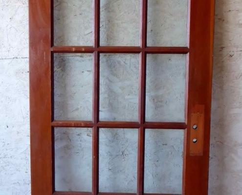 Antique single French door with fifteen glass panes / lites, with swing pivot. 