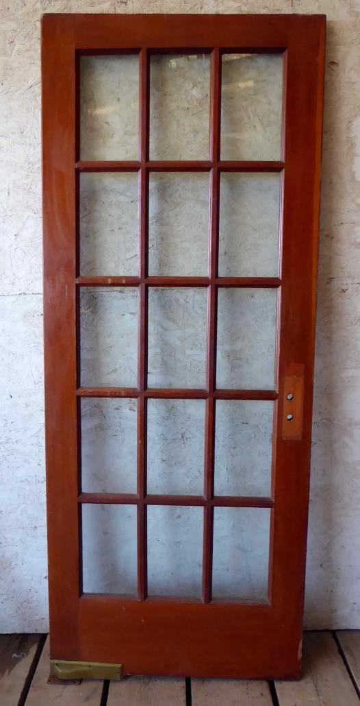Antique single French door with fifteen glass panes / lites, with swing pivot. 