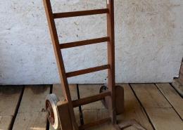 Old vintage industrial warehouse hand cart, made of solid steel with rubber wheels. 
