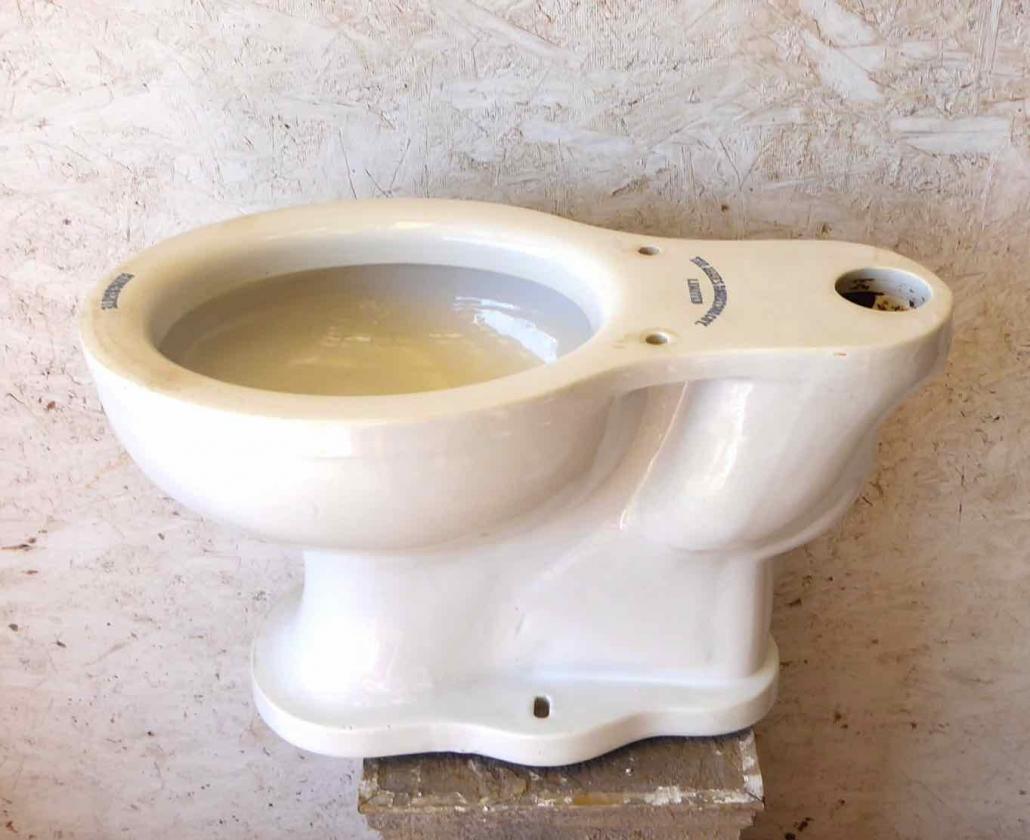 Antique porcelain toilet. Kingsmute model made by James Roberston Coy Company Limited. Prop rental only.