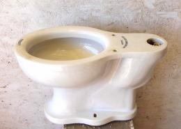 Antique porcelain toilet. Kingsmute model made by James Roberston Coy Company Limited. Prop rental only.
