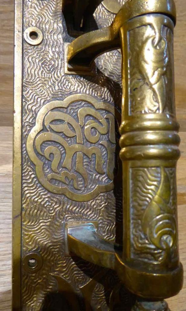 Closeup of detail - Eastlake style cast brass thumblatch entry set with extraordinary detailed design work.