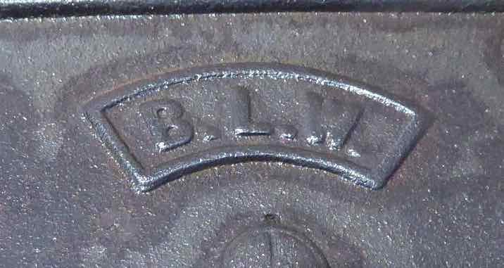Closeup of BLW logo on antique cast iron rim lock
