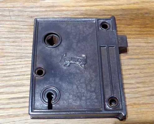 Antique cast iron rim locks, manufactured and signed on both sides with A. L. Co. makers mark.