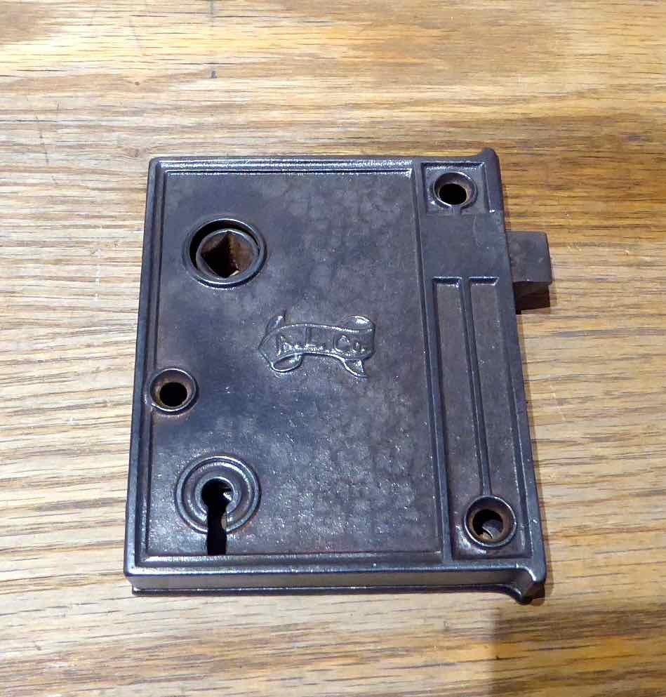 Antique cast iron rim locks, manufactured and signed on both sides with A. L. Co. makers mark.