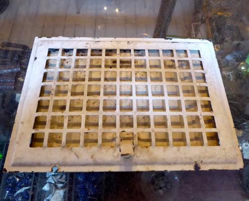 Antique steel wall grate (missing back). 