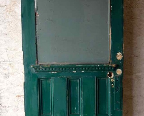 Large antique oversize exterior glazed entry door originally from the historic Walton Hotel in Port Hope Ontario. Originally glazed, been boarded up, needs glass. 