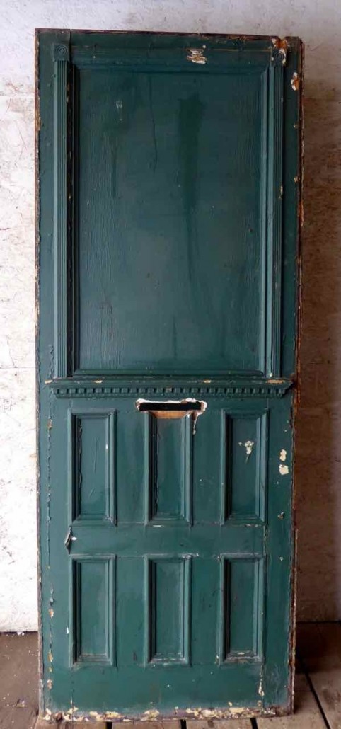 Large antique oversize exterior glazed entry door originally from the historic Walton Hotel in Port Hope Ontario. Originally glazed, been boarded up, needs glass.