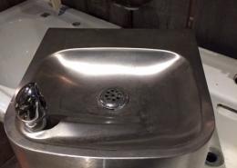 Old antique stainless steel drinking fountain