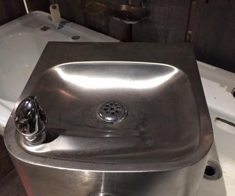 Old antique stainless steel drinking fountain