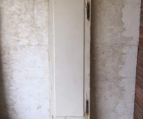 Tall and slender antique single solid door