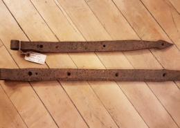 Pair of antique iron strap door hinges in separate sizes