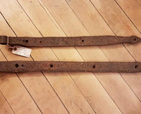 Pair of antique iron strap door hinges in separate sizes