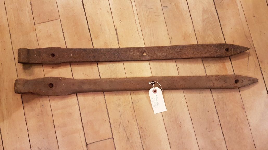 Two antique strap door hinges
