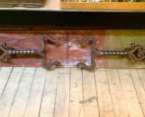 Large antique cast iron door pulls made from andirons