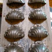 Extraordinary set of eight antique cast iron pulls, originally street lamp bolt covers from Ottawa