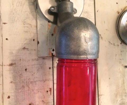 Vintage mid-century industrial sconce light with red glass