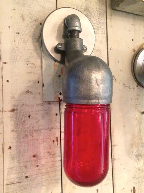 Vintage mid-century industrial sconce light with red glass