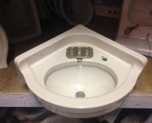 Antique porcelain corner sink